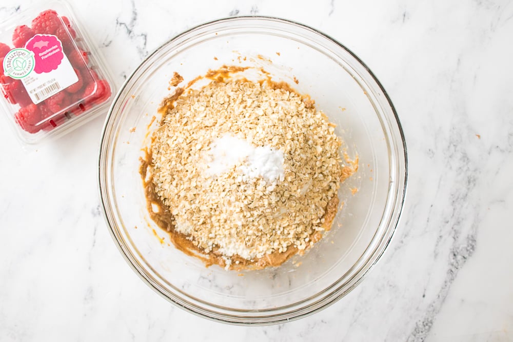 Adding dry ingredients into mixing bowl.