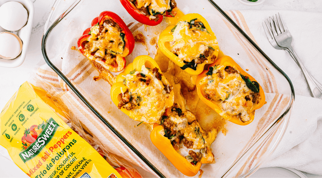Breakfast Stuffed Peppers in pans with NatureSweet Mixed Bell Peppers