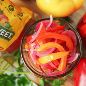 Pickled Bell Peppers in mason jar with NatureSweet packaging