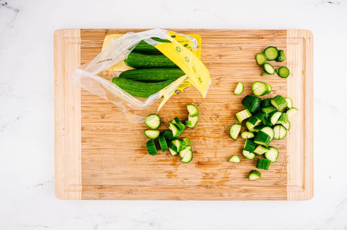 Cut cucumbers into half moon shapes.