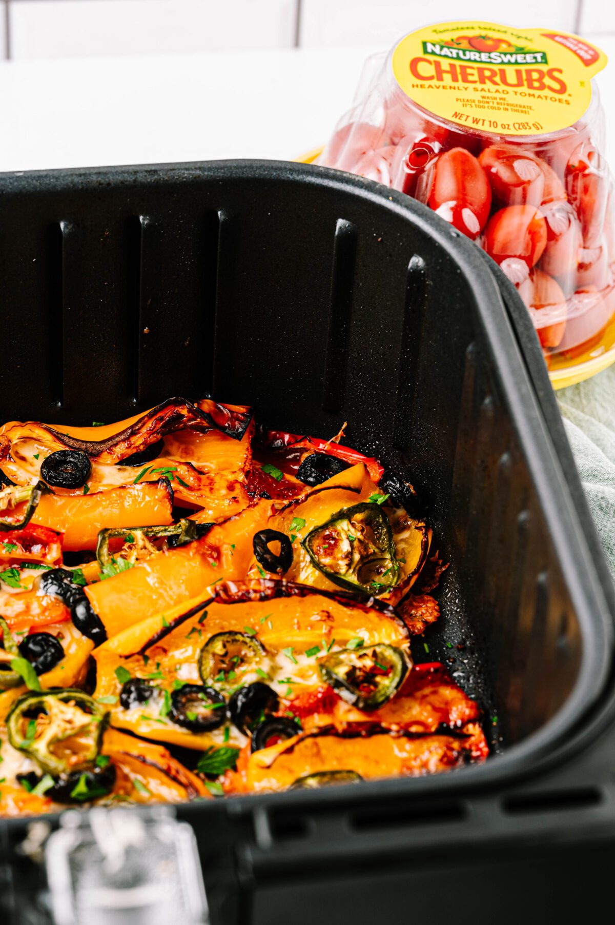 Side view of air fryer mini bell pepper nachos