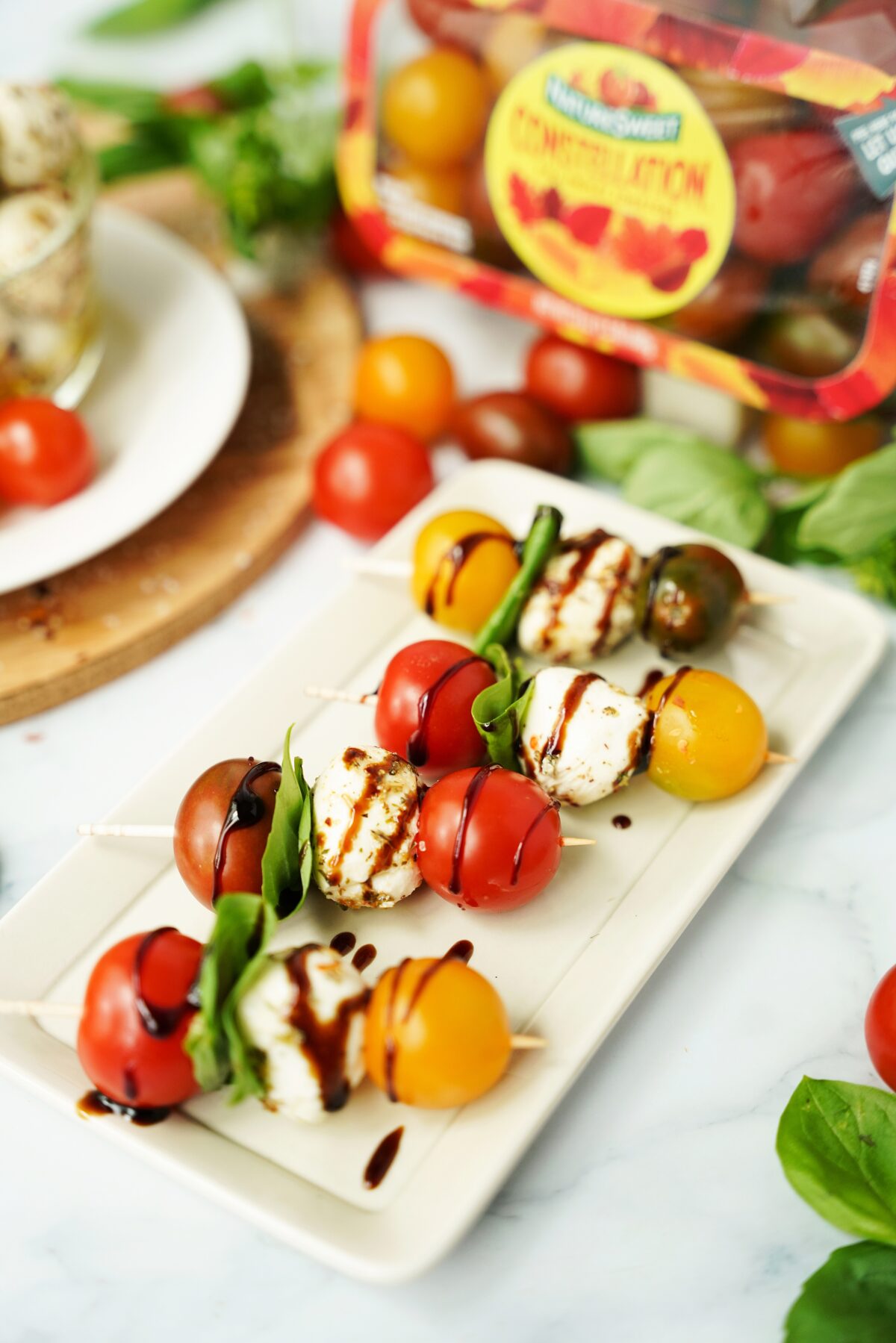 Close up of caprese skewers on white plate