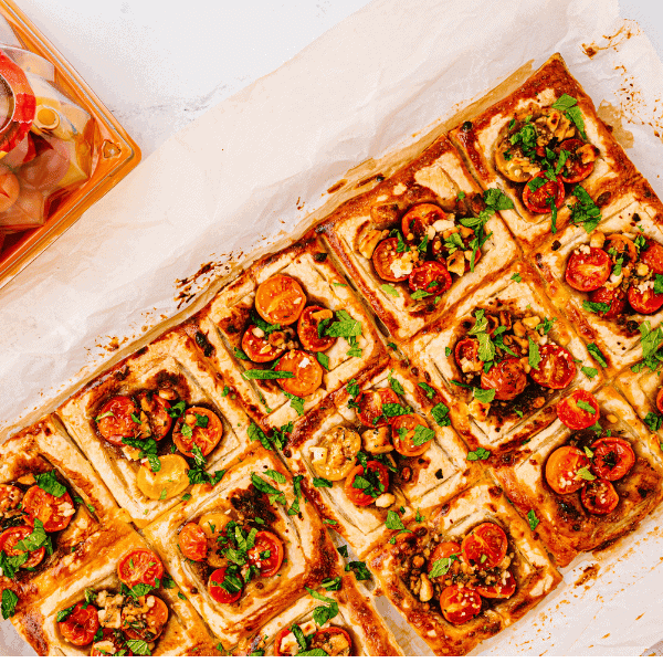 Overhead view of fresh Tomato Tart with NatureSweet Constellation® packaging