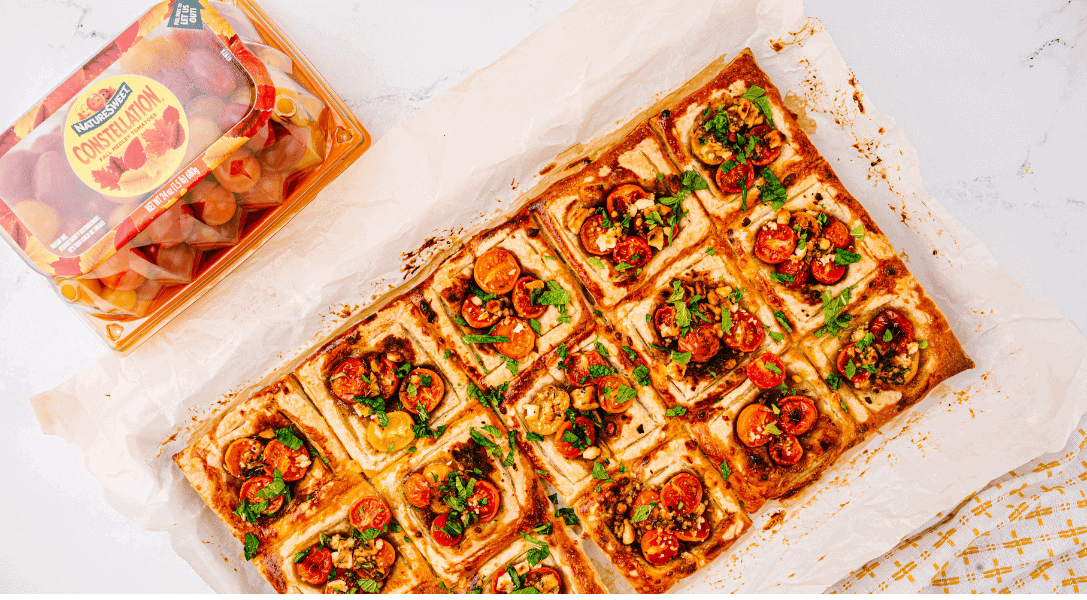 Overhead view of fresh Tomato Tart with NatureSweet Constellation® packaging