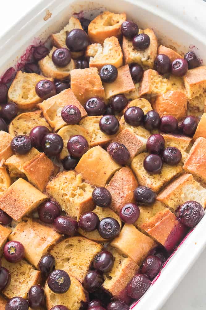 blueberries on top of the French bred in casserole dish
