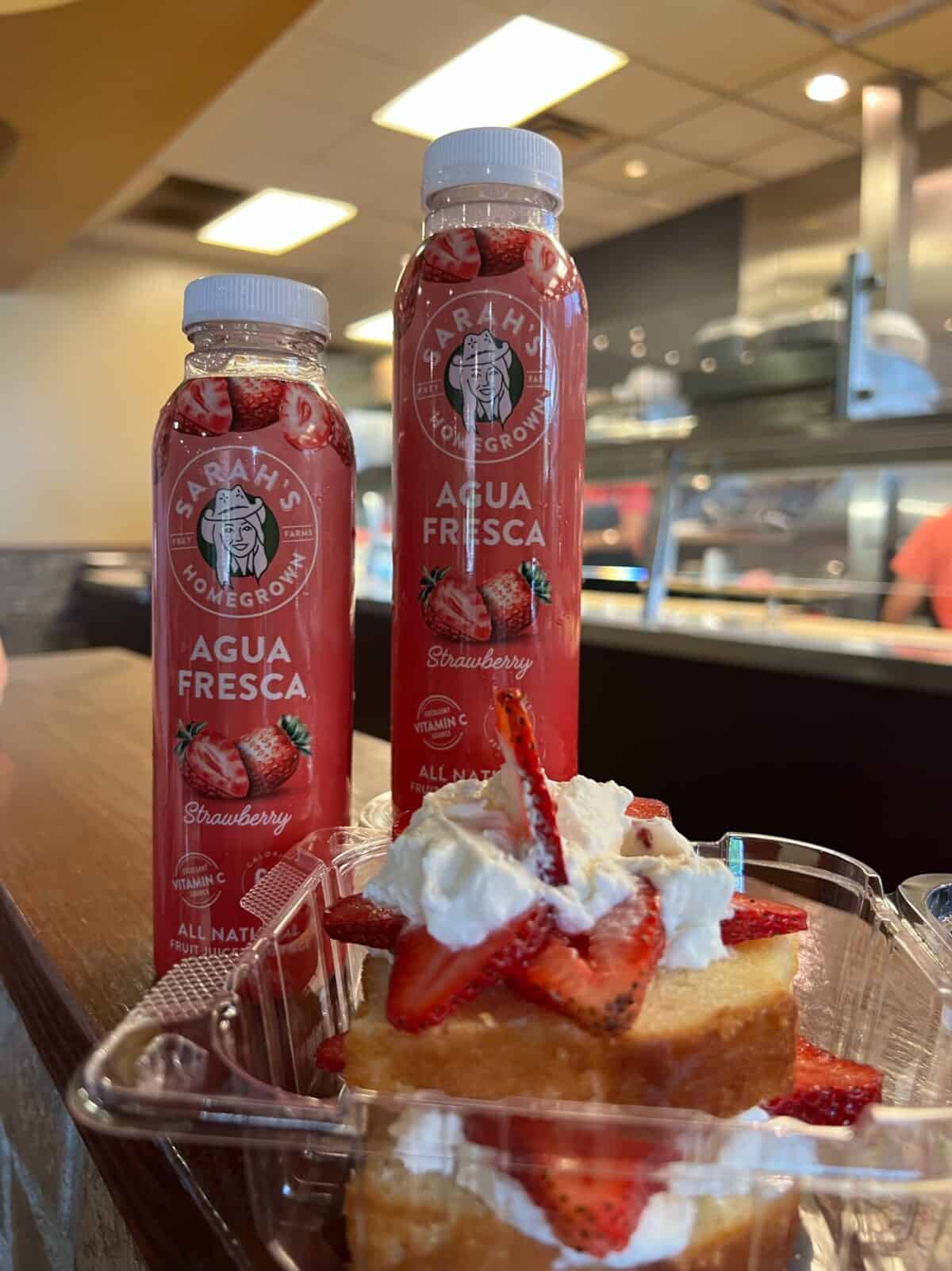 two bottles of strawberry agua fresca with strawberry shortcake at jason's deli