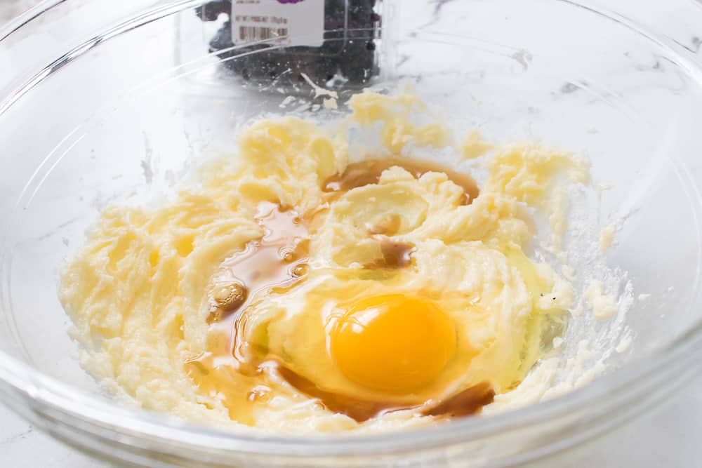 egg and vanilla extract into butter and sugar cream