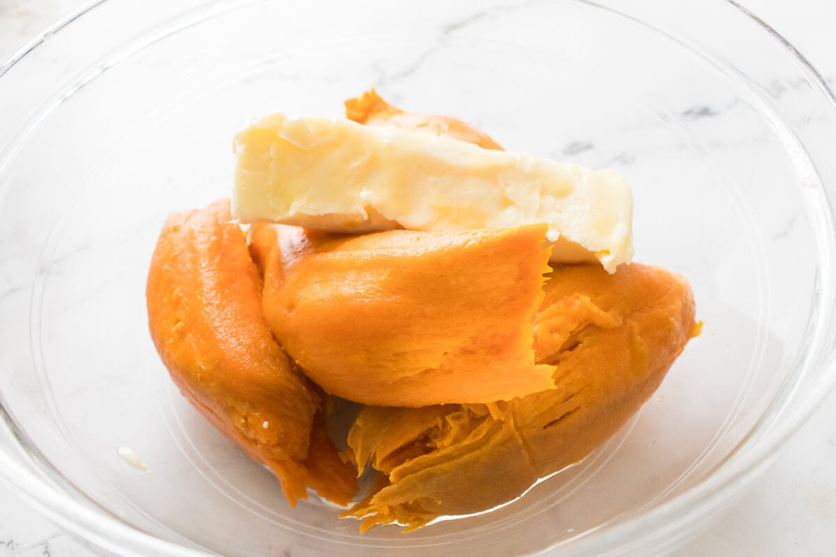 sweet potatoes and butter in glass bowl