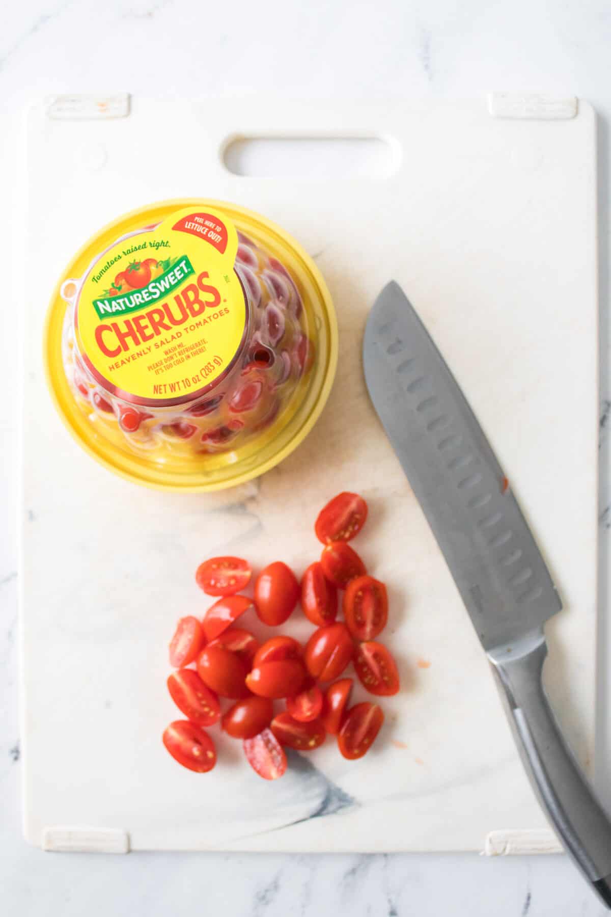 overhead shot of Naturesweet cherub tomatoes that have been halved