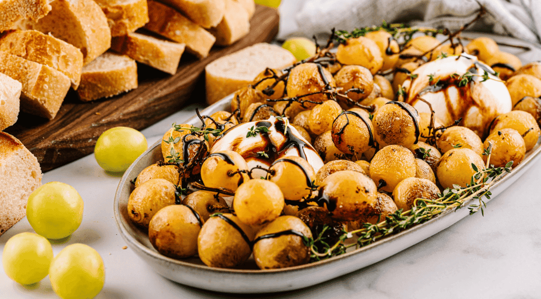 Burrata and Roasted Grapes on platter with bread