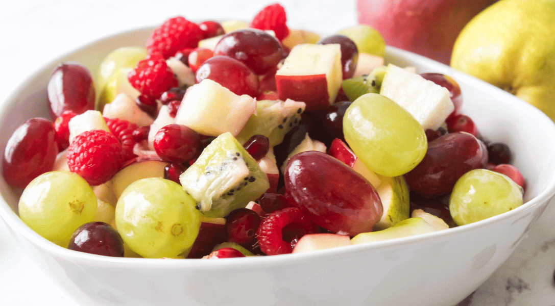 Christmas fruit salad in a white bowl