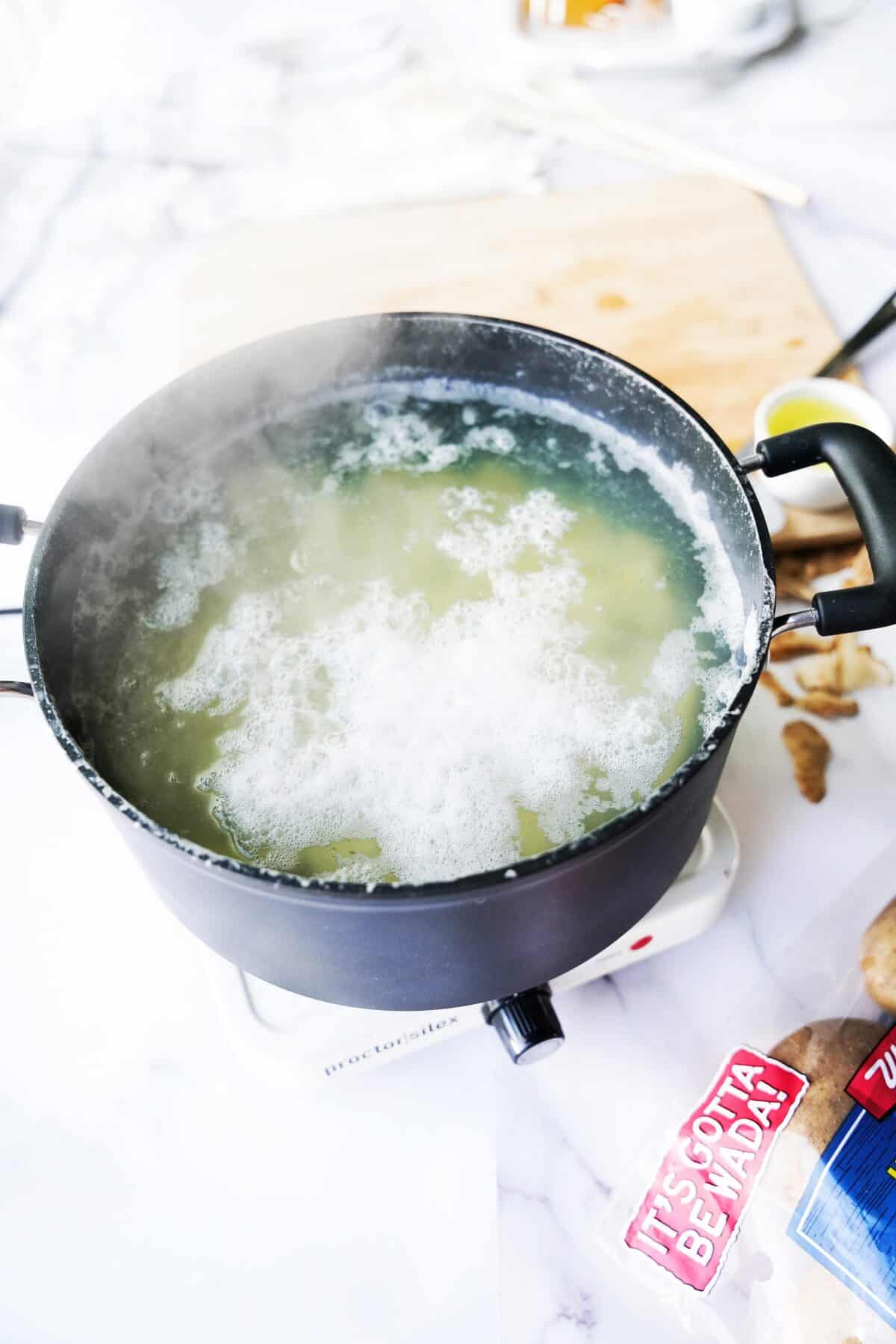pot par-boiling potatoes