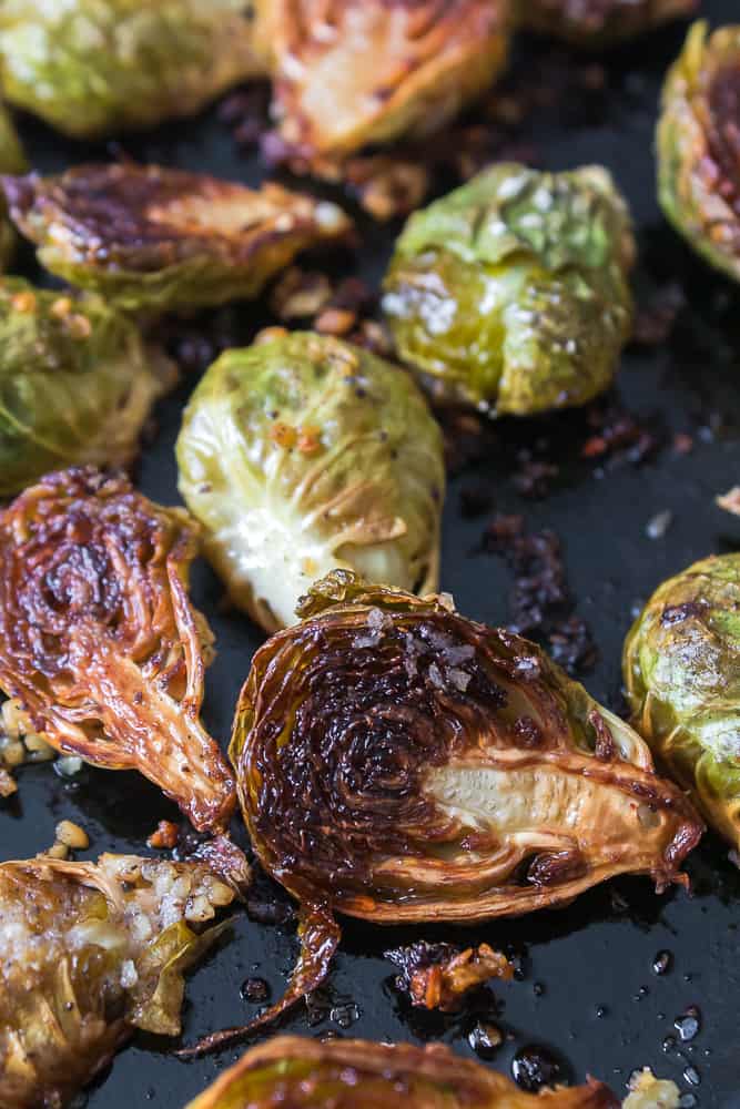 close up of roasted brussel sprouts in cast iron skillet