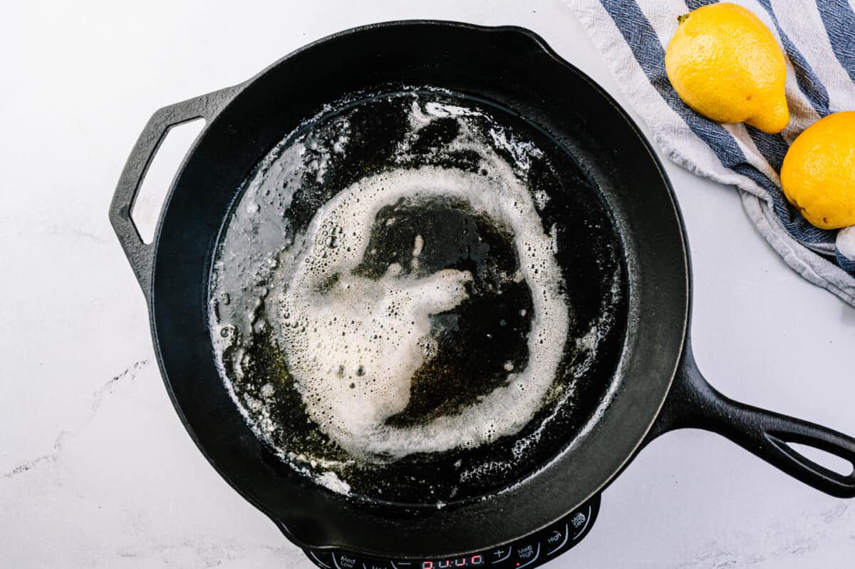 Heat the oil and butter in a cast iron skillet.