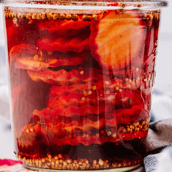 close up of Pickled Radishes in glass jar