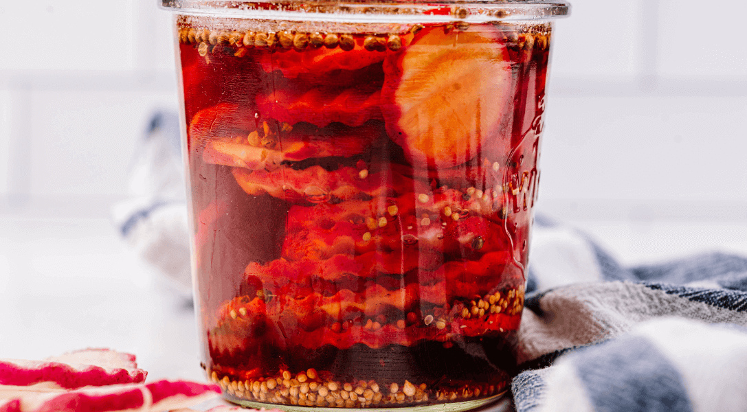 close up of Pickled Radishes in glass jar