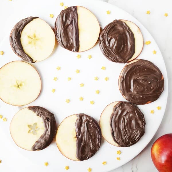 Apple slices covered in chocolate showcasing the phases of the moon