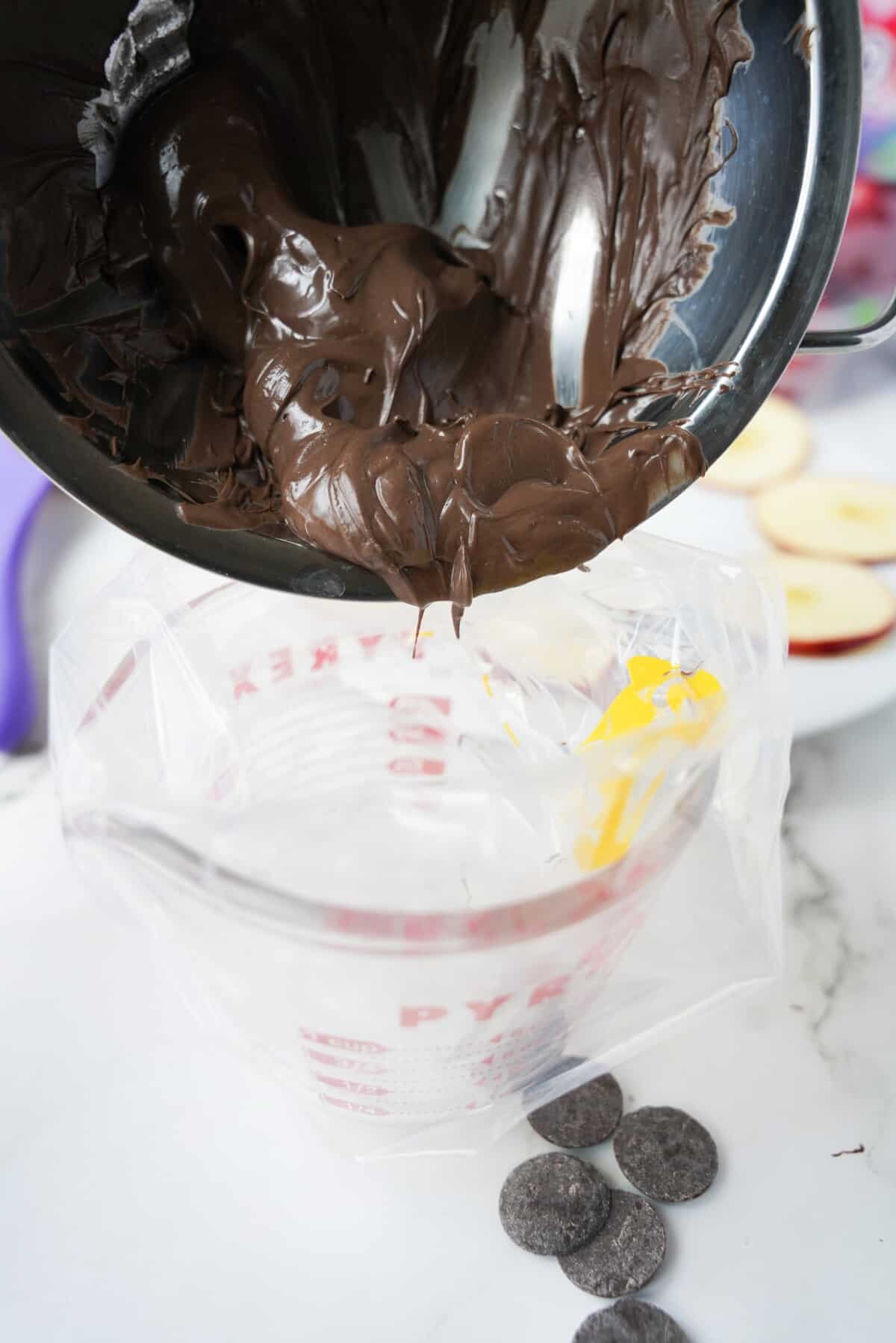 Melted chocolate being transferred to a piping bag.