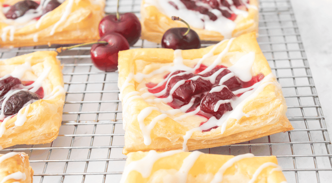 Cherry danishes on a wire rack