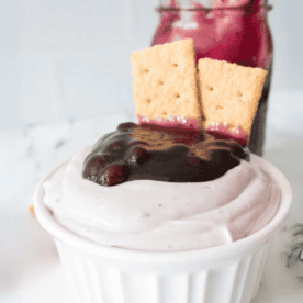 Blueberry Cheesecake dip with graham crackers in bowl