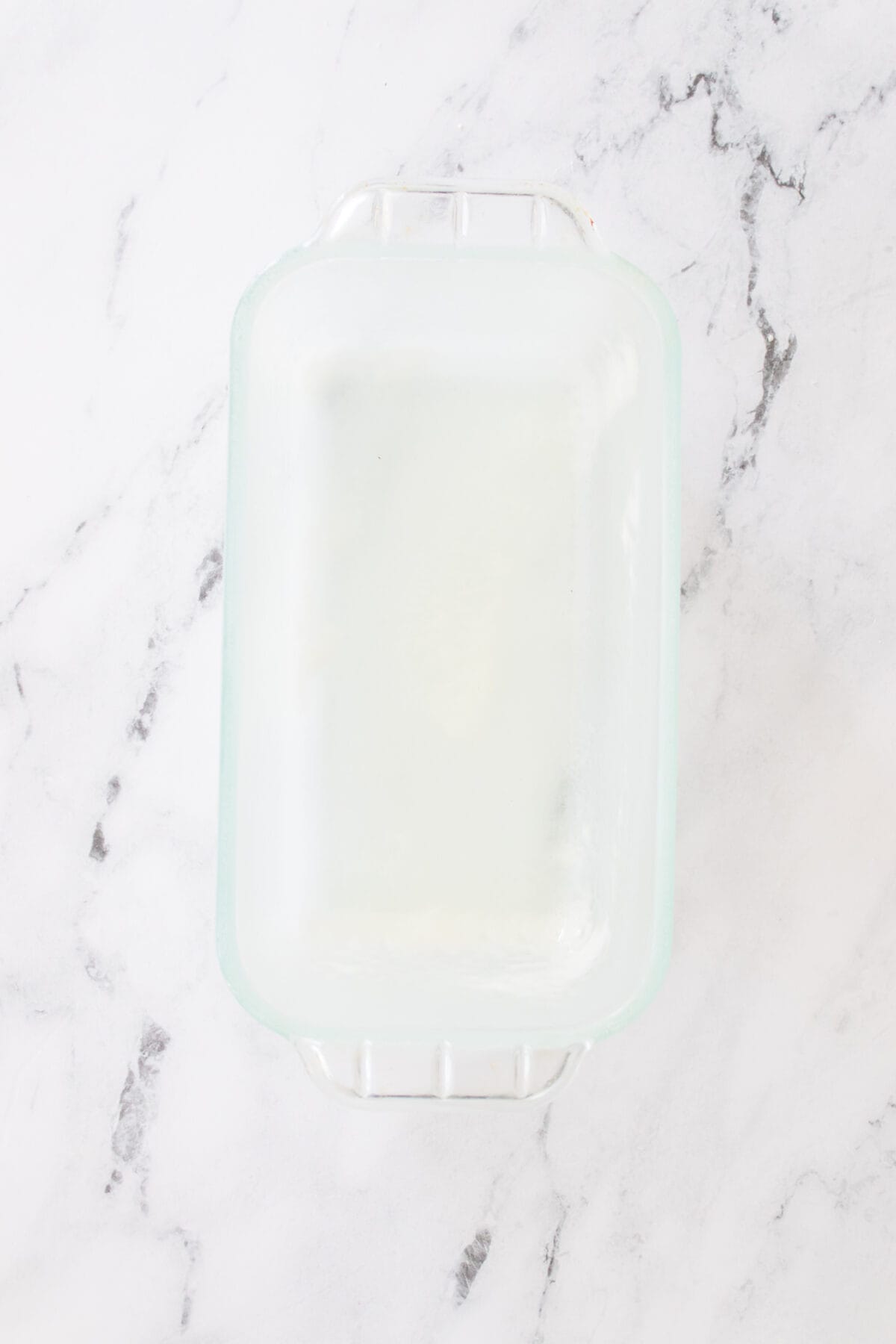glass loaf pan sprayed with non stick baking spray