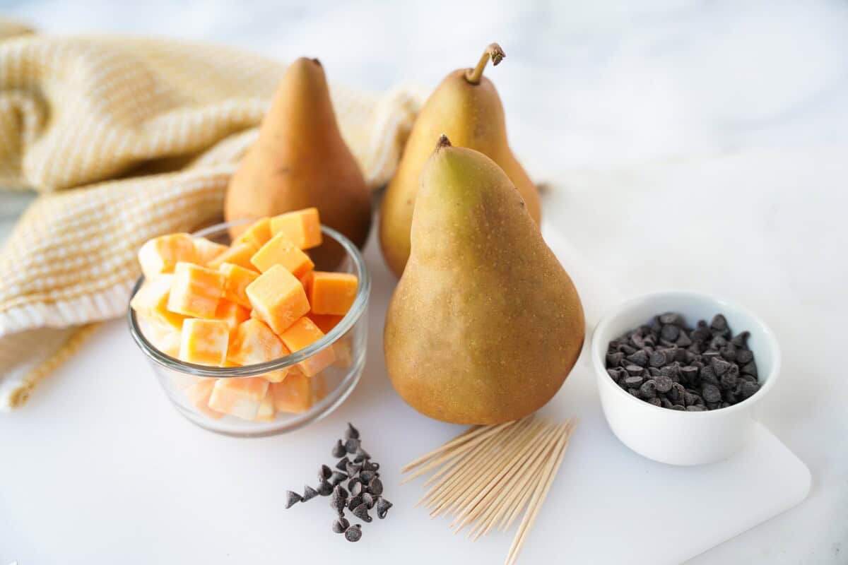 Pears, cheese cubes, toothpicks, and mini chocolate chips