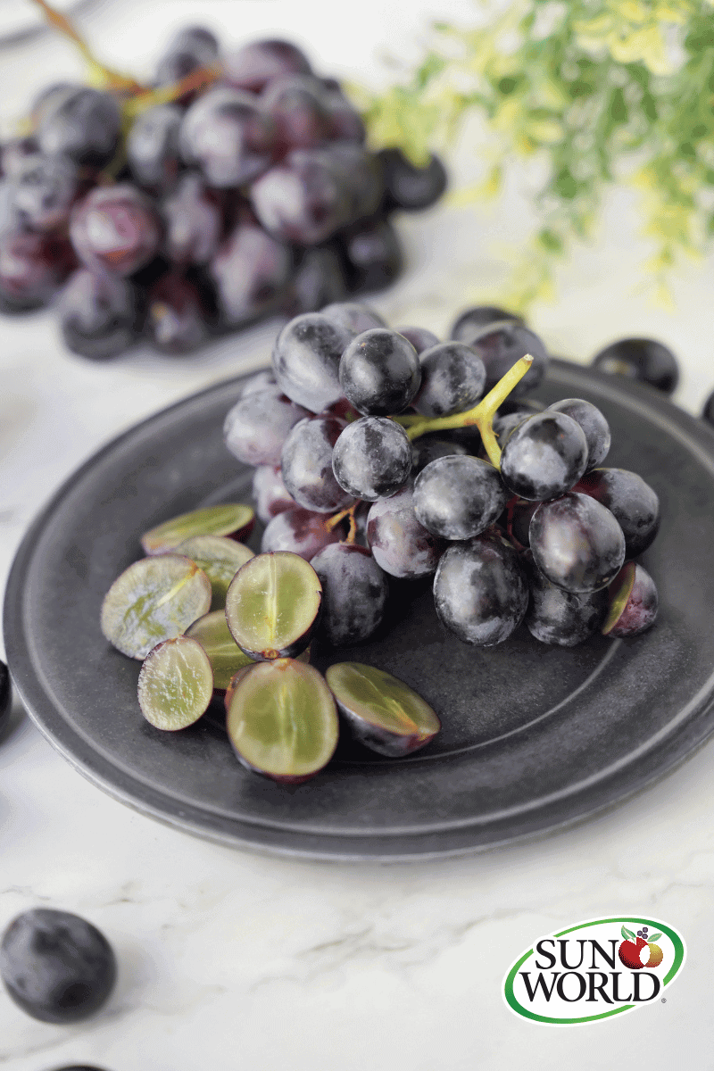 Sun World Black Grapes on plate
