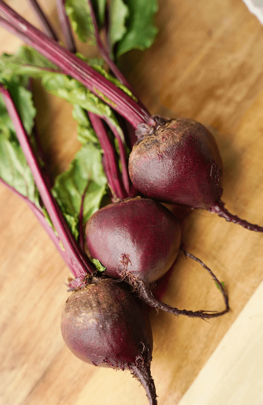 Vertical Whole Beets on cutting board