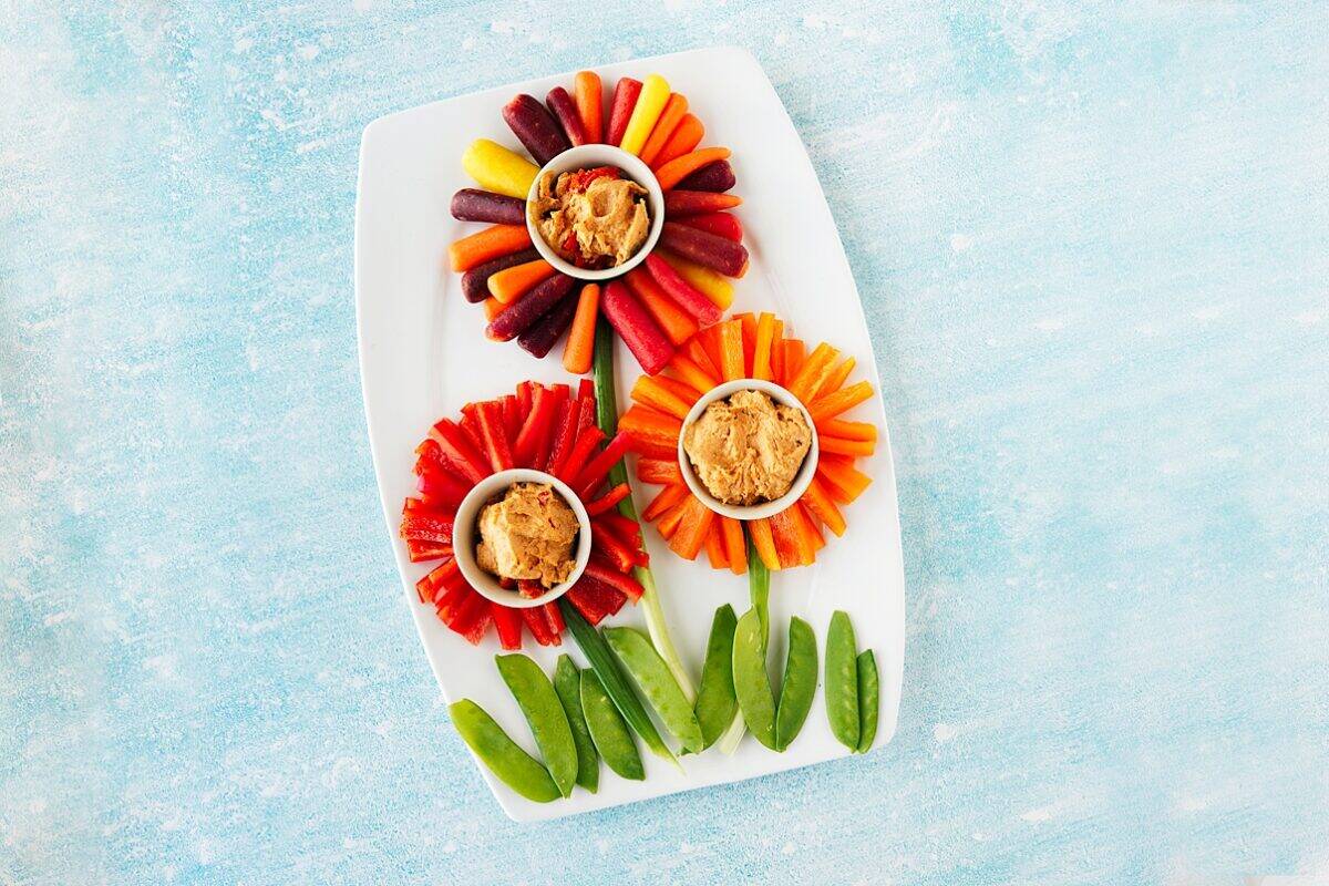 flower veggie tray with blue background
