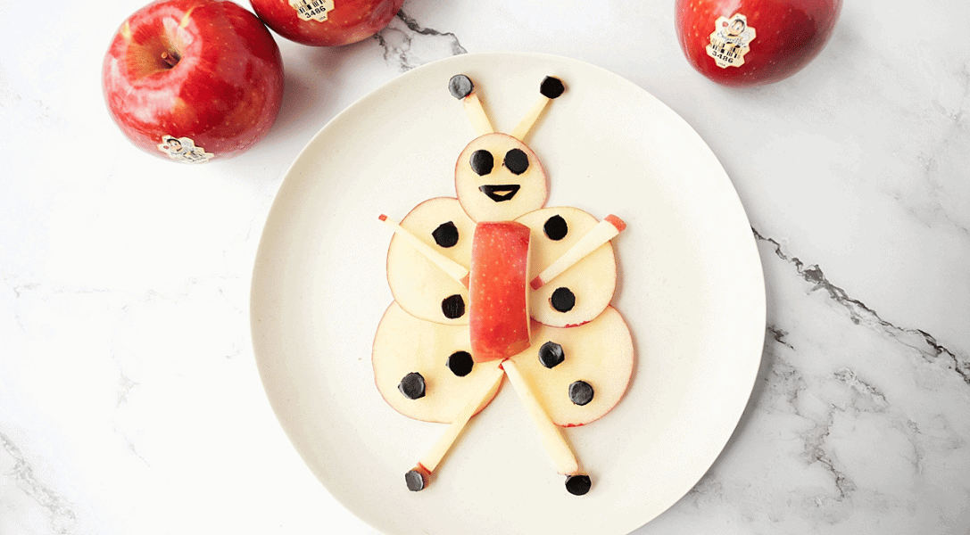 Honey Bee on plate made from apple slices and eggplant