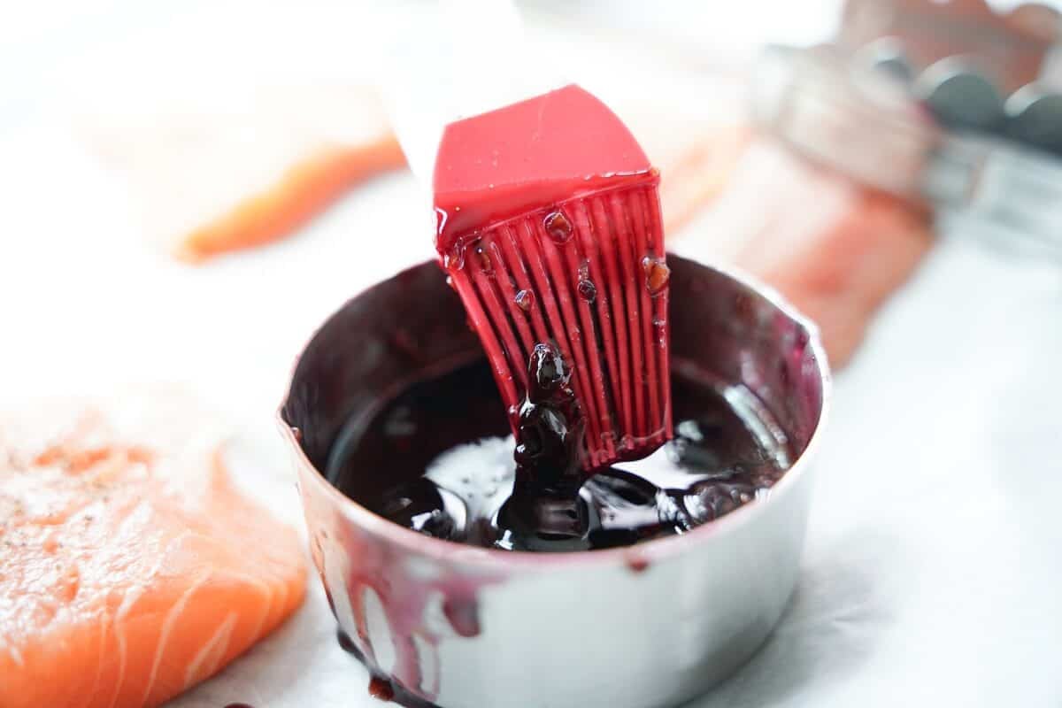 measuring cup with cherry jam