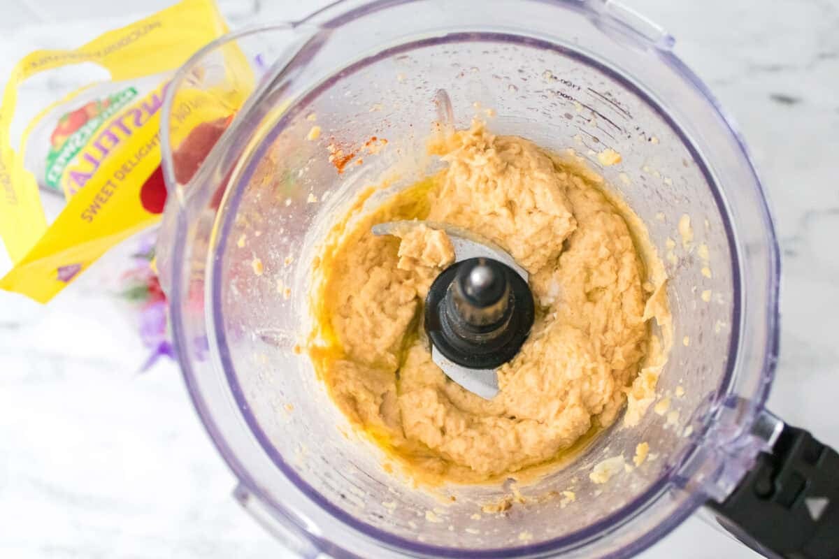 close up shot of hummus in food processor