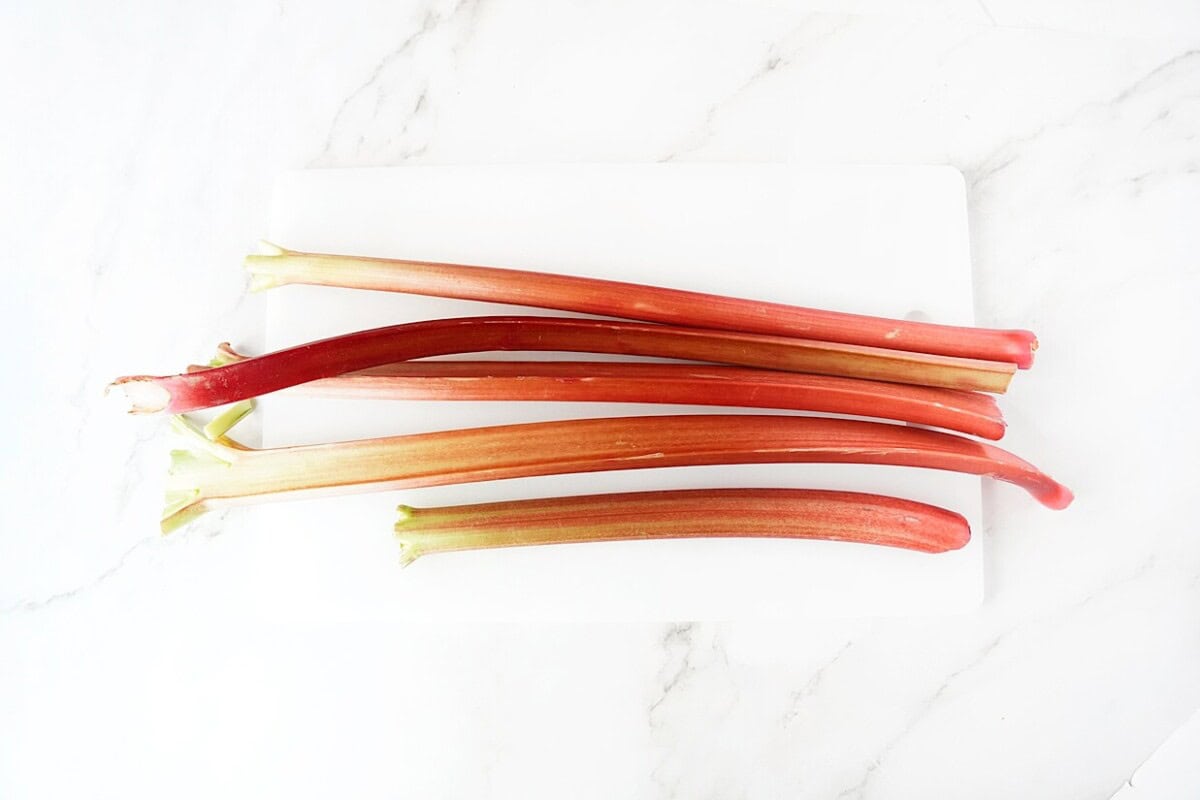 Stalks of rhubarb on cutting board
