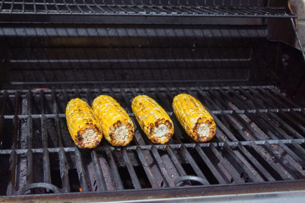 corn without husk and silk charred on grill
