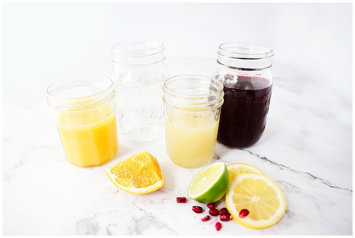 citrus pomegranate juice, citrus rounds, and pomegranate arils