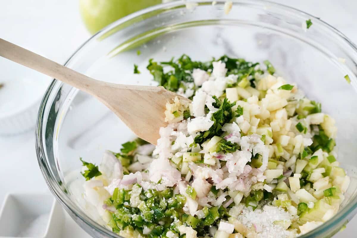 Combine all prepped ingredients in a mixing bowl.