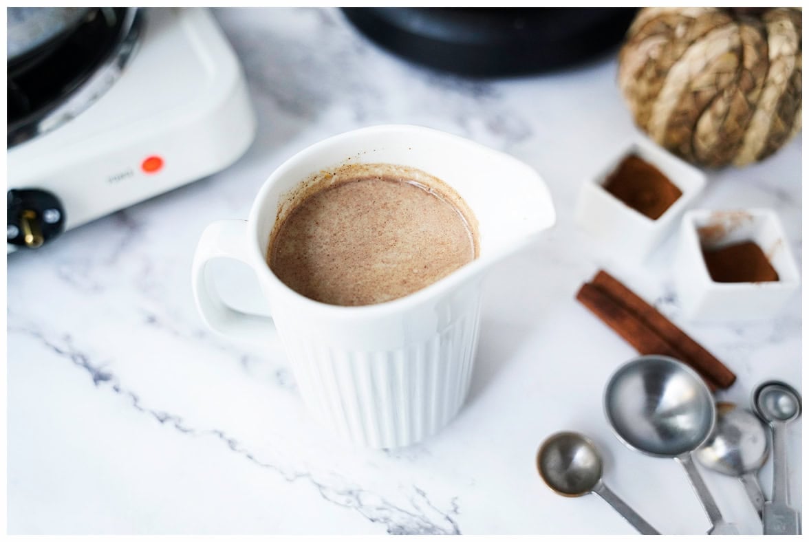 shot of pumpkin spice coffee creamer in white pourable container