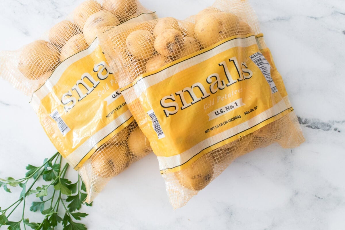 two 1.5 lb bags of wada farms smalls gold potatoes with fresh parsley