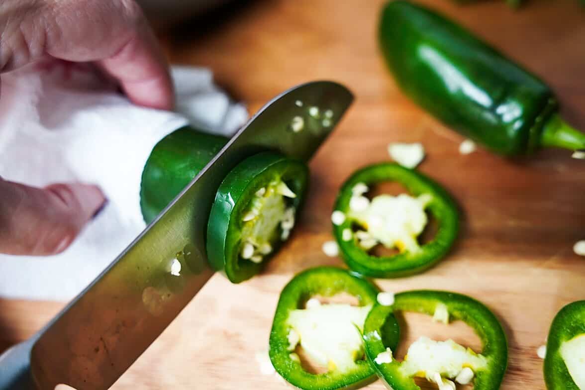Slicing a jalapeno pepper into rings