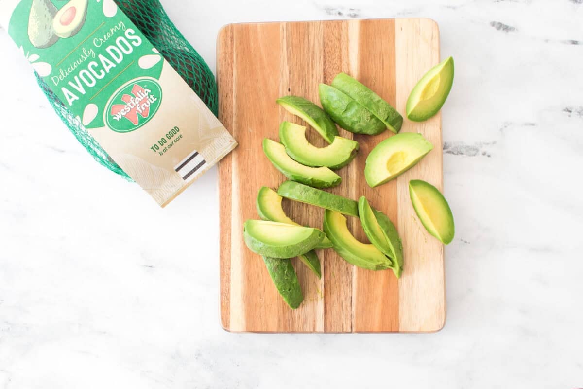 bag of westfalia fruit avocados with sliced avocados on cutting board