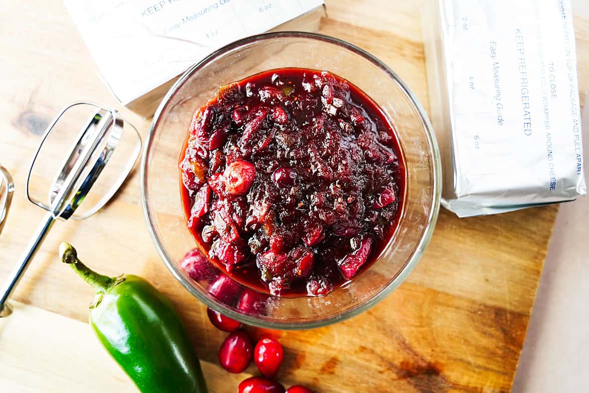 overhead shot of cranberry jalapeno jam mixture in glass bowl