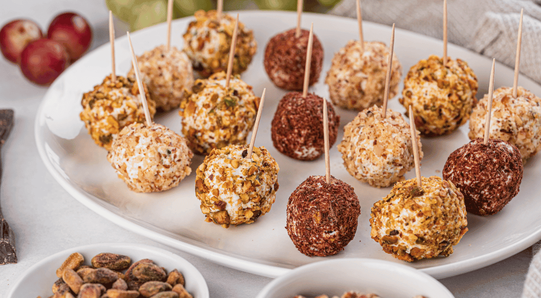 Savory Grape Truffles on white plate with toothpicks