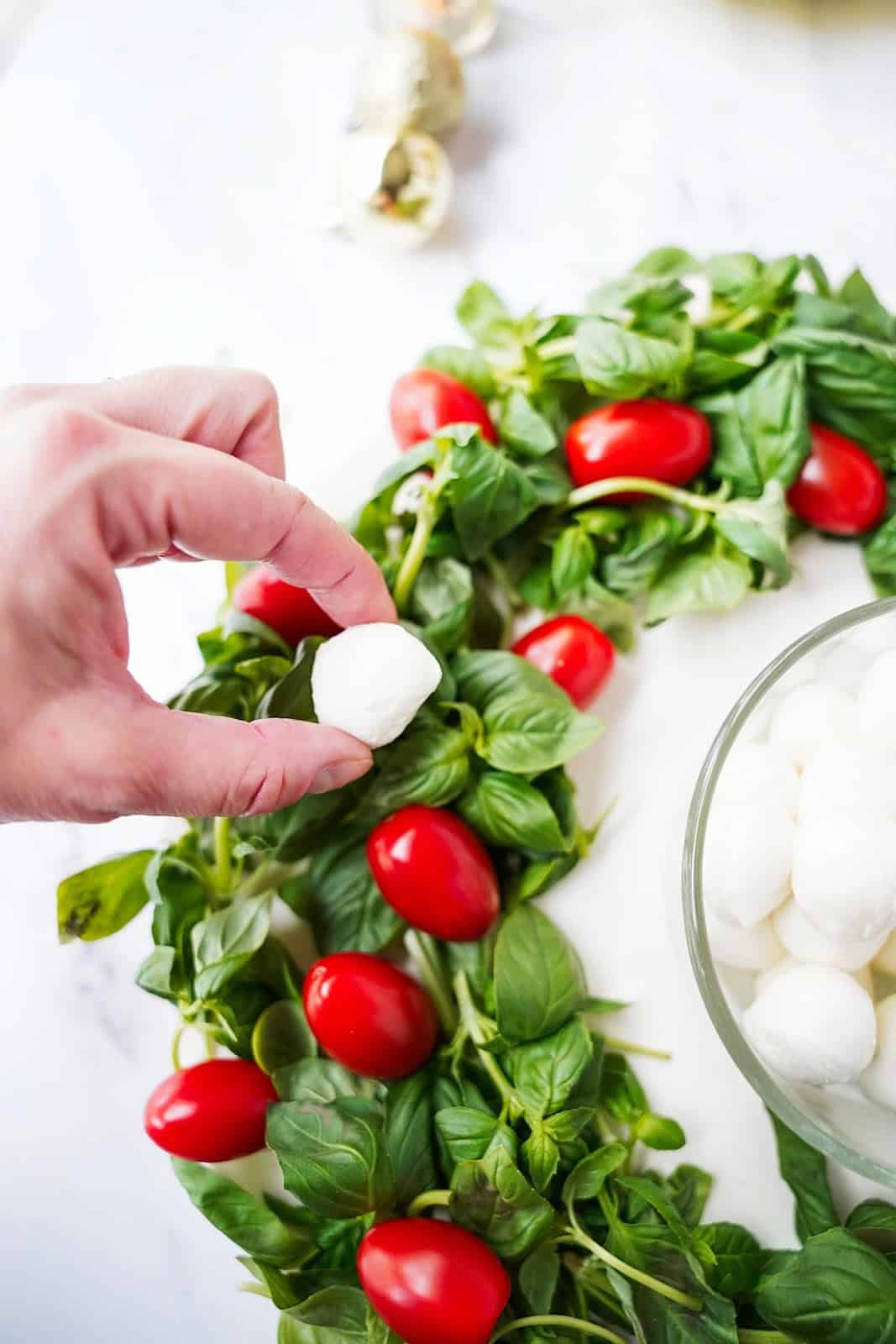 Add the mozzarella pearls.