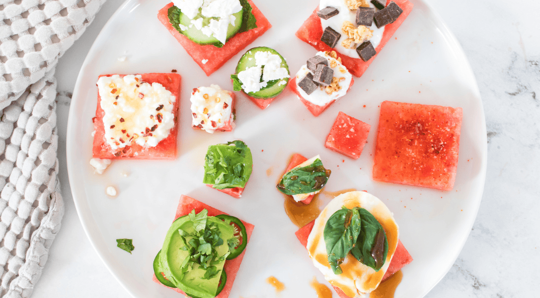 White plate holding watermelon flight with 6 flavor options