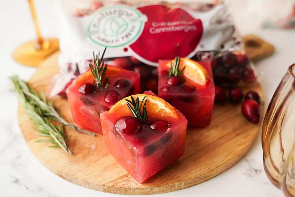close up of ice cubes on a wood tray