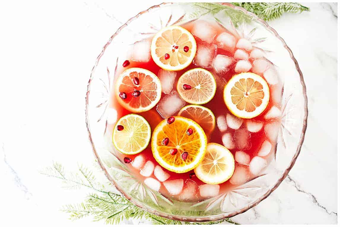 overhead shot of citrus punch in a large glass bowl