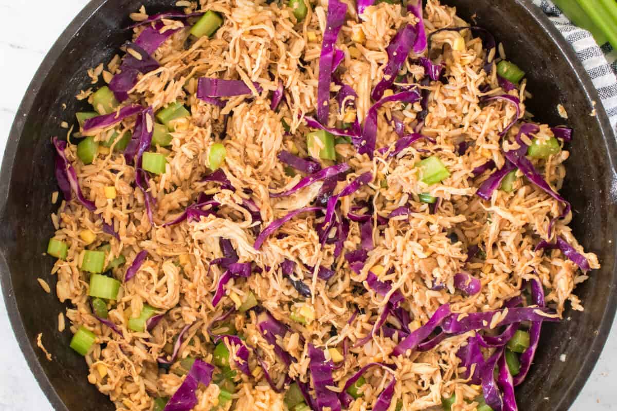 egg roll in a bowl after being heated through in a cast iron skillet