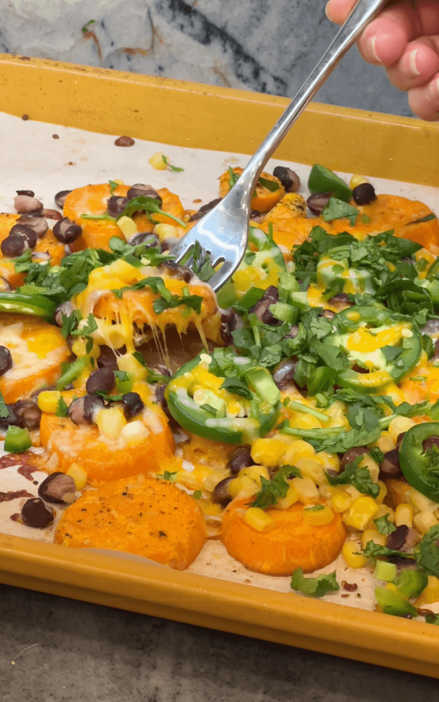 Fork lifting up sweet potato nachos
