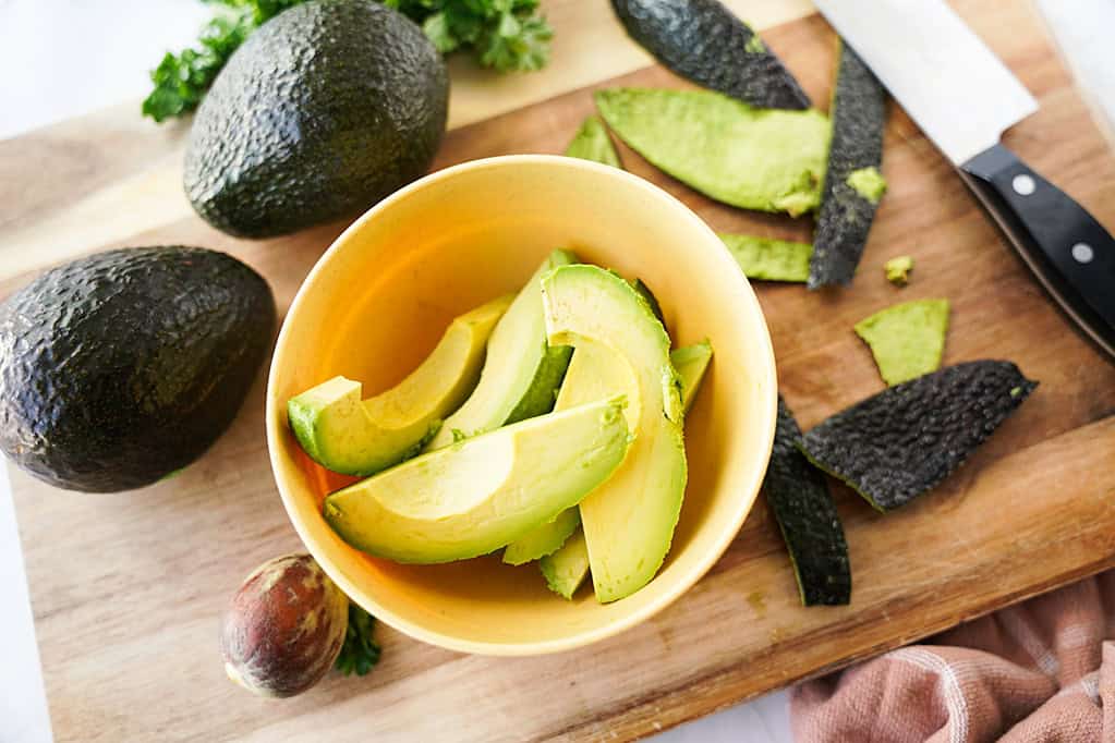 Avocado Slides in yellow bowl after peeling