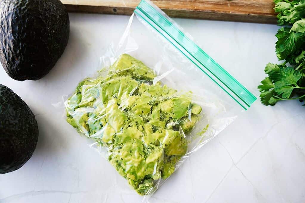 Mashed avocado in ziplock bag on kitchen counter